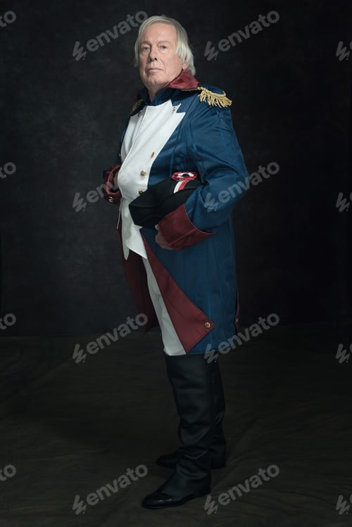 Preview: Official Portrait Of Senior Man Dressed In Historical Emperor Costume. Studio Shot Against Dark