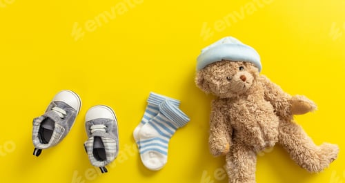 Preview: Baby boy shoes and socks on bright yellow background