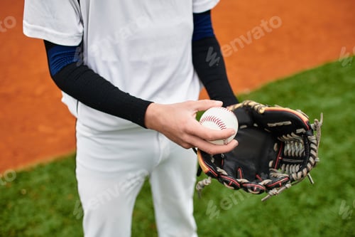 Preview: Talented player baseball ready to pitch on vibrant field under clear sky