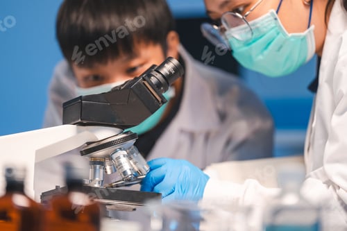Preview: researcher working in laboratory for medicals science research using scientific equipment technology
