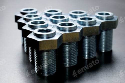 Preview: Close-up of several chrome metal bolts