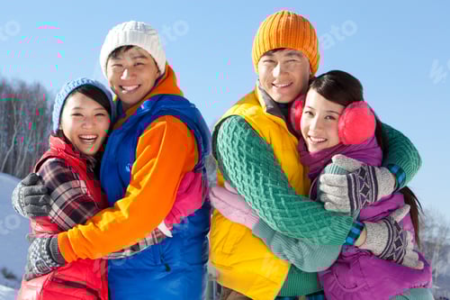 Preview: Happy young people in ski resort