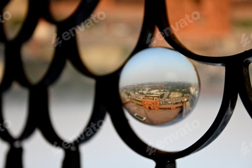 Preview: Closeup shot of the red fort in the old town of Delhi, India in a glass ball
