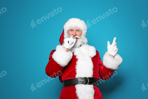Preview: Santa Claus singing into microphone on color background. Christmas music