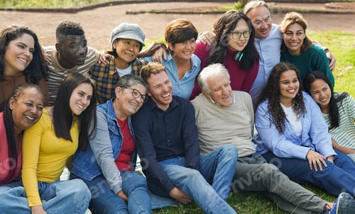 Preview: Crowd of multi generational people having fun together at city park