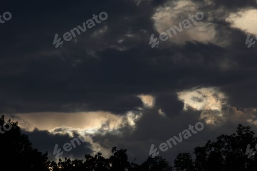 Preview: Dark Clouds At Sunset - Photograph Of Some Dark And Dramatic Clouds At Sunset. Selective Focus On