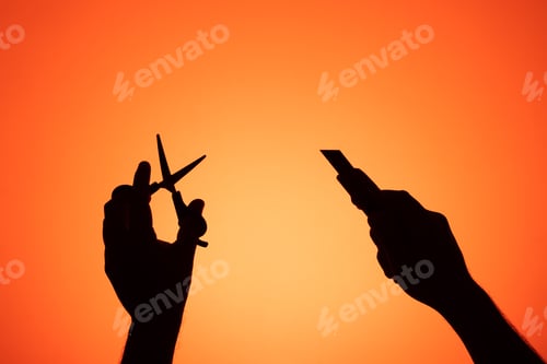 Preview: Hands holding homemade cutting tools. Photography with silhouettes