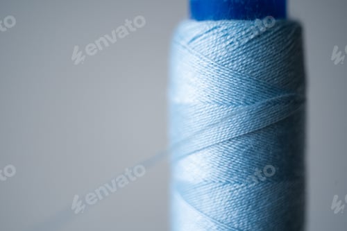 Preview: Blue sewing thread, close-up, macro