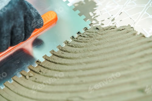 Applying Adhesive for Tile Installation with Trowel