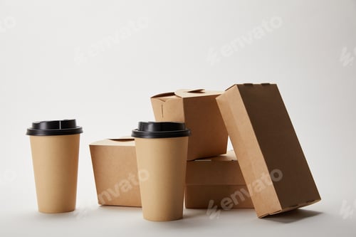 Preview: disposable coffee cups and cardboard food boxes on white
