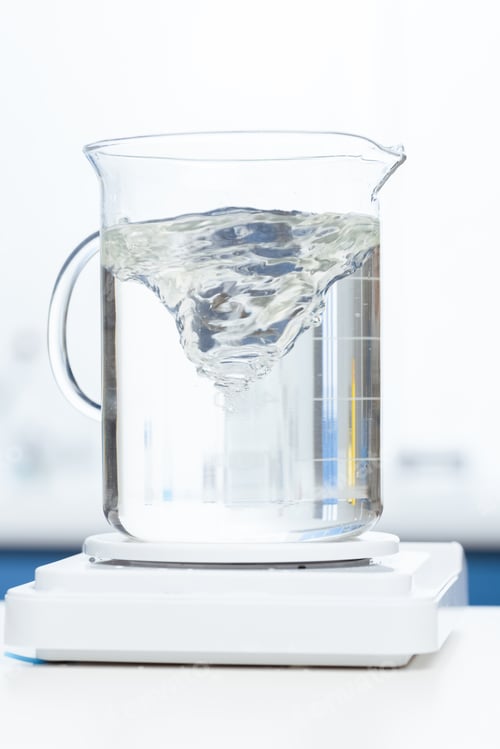 Preview: close up view of chemical liquid in laboratory glassware on scales