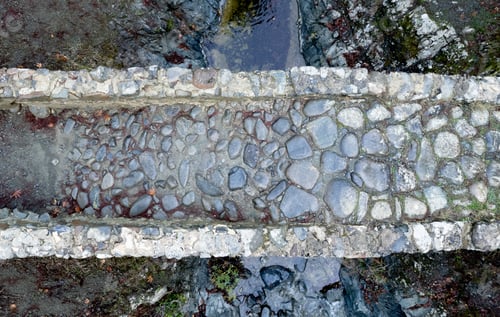 Preview: Aerial drone scenic of a medieval stoned bridge with water flowing in the river. Elia Bridge Troodos