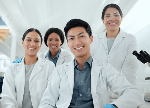 Preview: This is a group effort. Shot of a proud team of scientists together in their lab.