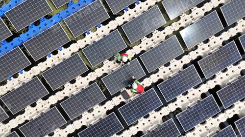 Preview: Floating solar panels providing renewable energy. Aerial view floating on solar cells