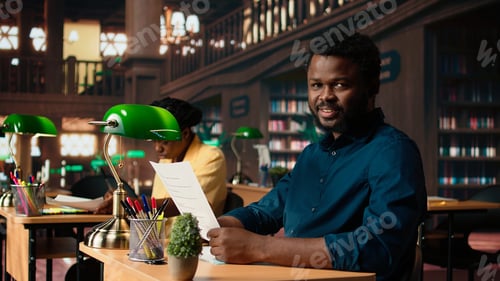 Preview: University student researches academic topics in a traditional library