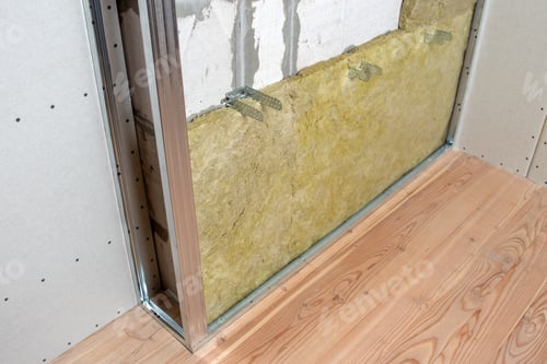Preview: Wall of a room under renovation with mineral rock wool insulation and metal frame