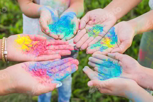 Preview: Indian holidays, fun and Holi festival concept - Female palms covered in different colors