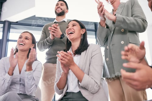Preview: So proud of our team. Shot of a group of businesspeople applauding during a meeting.