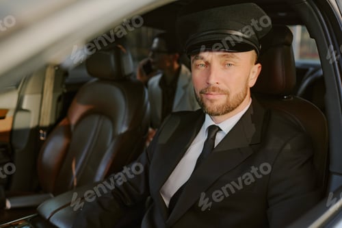 Preview: Portrait of Middle Aged Man Driving Car with Business Passenger