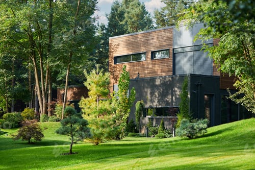 Preview: Modern wooden cottage house built in pine forest
