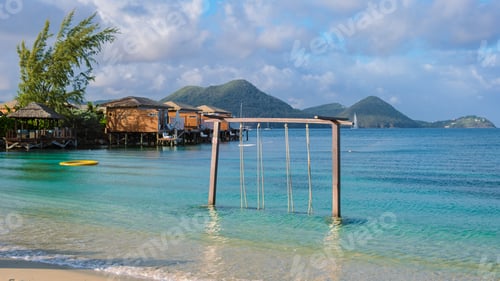 Preview: Swing in the ocean on the Beach of the tropical Island Saint Lucia or St Lucia Caribbean