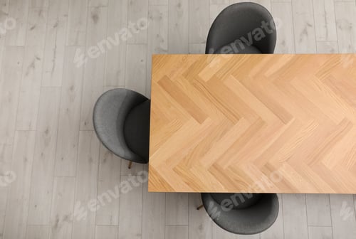 Preview: Wooden table and grey chairs indoors, top view