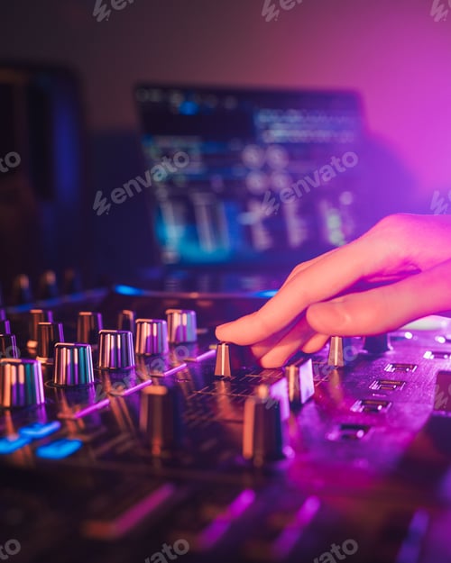 Preview: Professional audio mixing board connected to a laptop, displaying the various knobs and buttons.