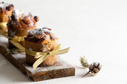Preview: Panettone on a piece of wood and white background.