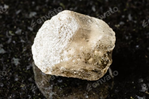 Preview: sample of raw phenakite rock on black granite