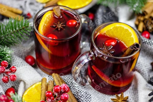 Preview: hot mulled wine on a wooden table. New year concept