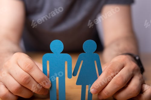 Preview: Male's hands holding a partnership concept paper cut off.