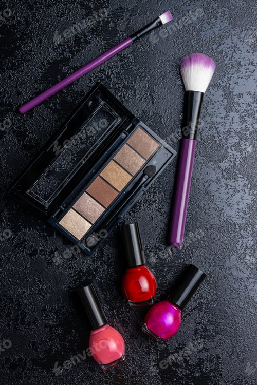 Preview: Set of cosmetic makeup products. Eyeshadow, nail polish and makeup brushes.