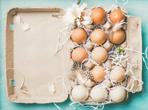 Preview: Natural colored eggs for Easter in box, blue background