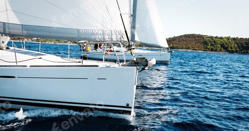 Preview: Sailing yachts with white sails in the sea
