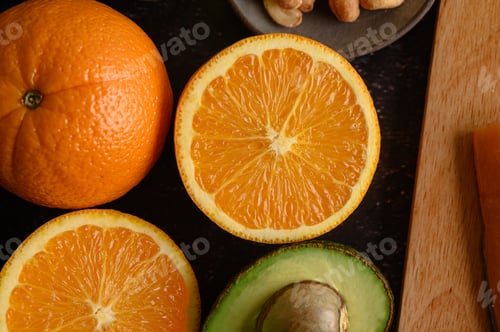 Preview: close up with Slice of fresh orange and avocado.