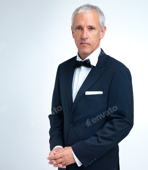 Preview: Serious business. A studio shot of a mature man in a tuxedo.