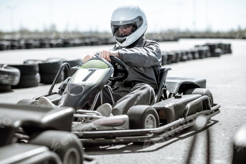 Preview: Driver in Racing Kart on Track