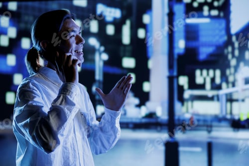 Preview: Man on street at night making calls