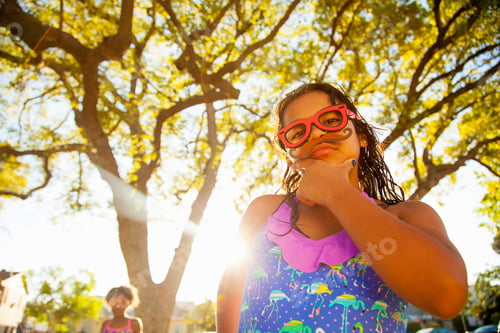 Preview: Portrait of girl in spectacles and mustache in garden