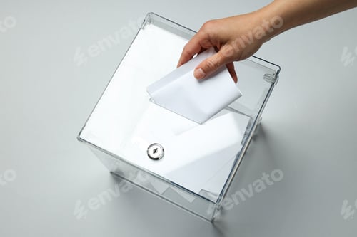 Preview: Voting box with papers and hand on gray background, top view