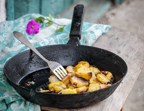 Preview: Fried Potatoes With Onions In A Pan Outdoors. Vintage Background, Rustic