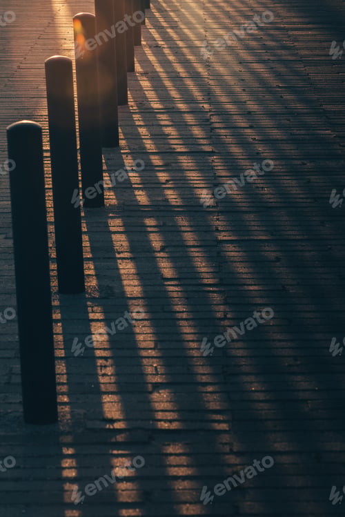 Preview: Vertical shot of columns on a pier during sunset