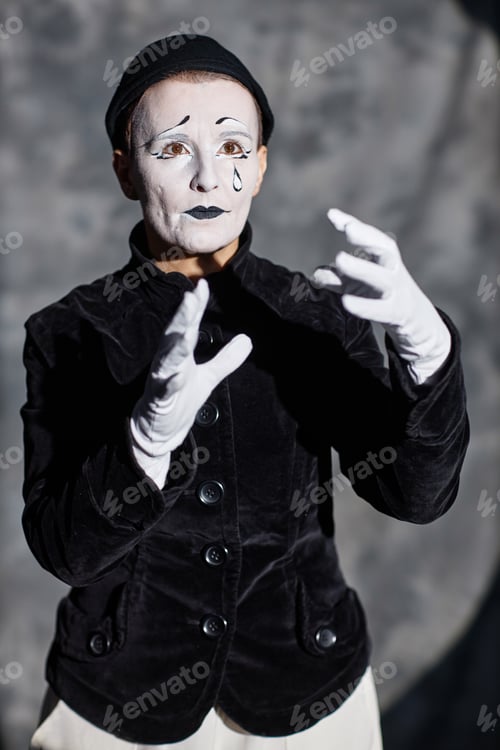 Preview: Mime Artist Performing on Stage with Sad Emotion