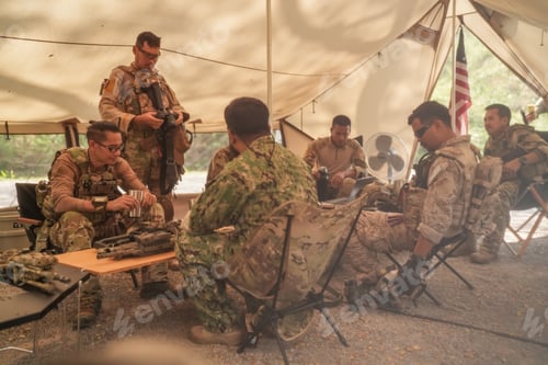 Preview: US Army Rangers group with weapons. army , planning strategy or teamwork