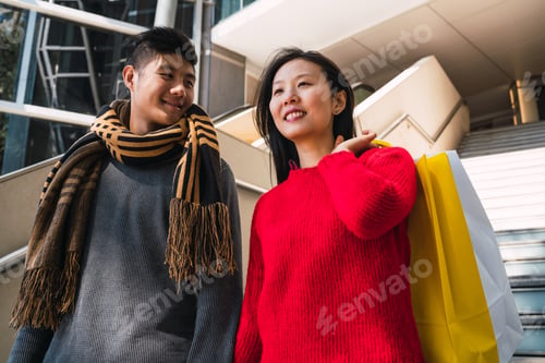 Preview: Asian couple shopping in the mall.