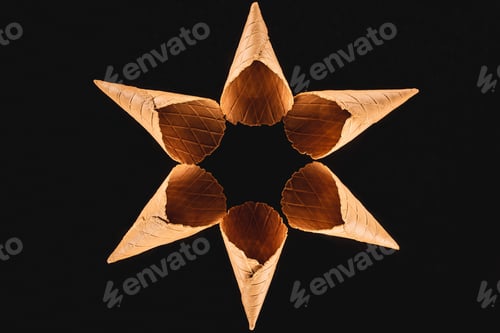 Preview: top view of appetizing ice cream cones isolated on black