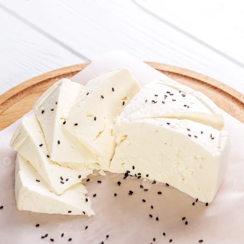 Preview: Feta cheese with sesame seeds. Top view. Square. The concept is