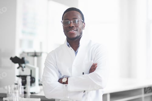 Preview: An African American worker works in a laboratory conducting experiments
