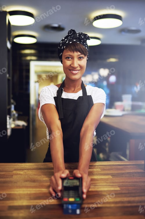 Preview: Young business owner waiting for payment