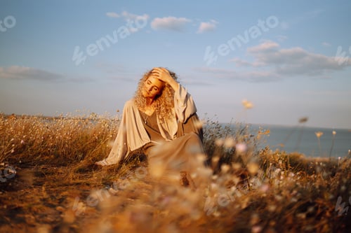 Preview: Young woman resting in nature. People, lifestyle, relaxation and vacations concept. Fashion.